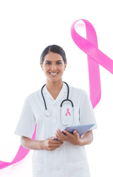 Digital composite of Doctor woman with breast cancer awareness ribbon Digital composite of Doctor woman with breast cancer awareness ribbon
